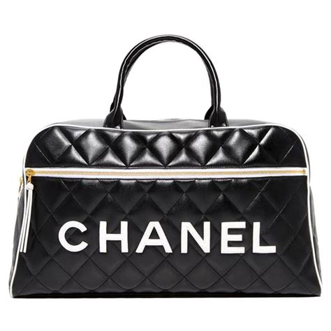 chanel duffle bag black and white|chanel travel bag with wheels.